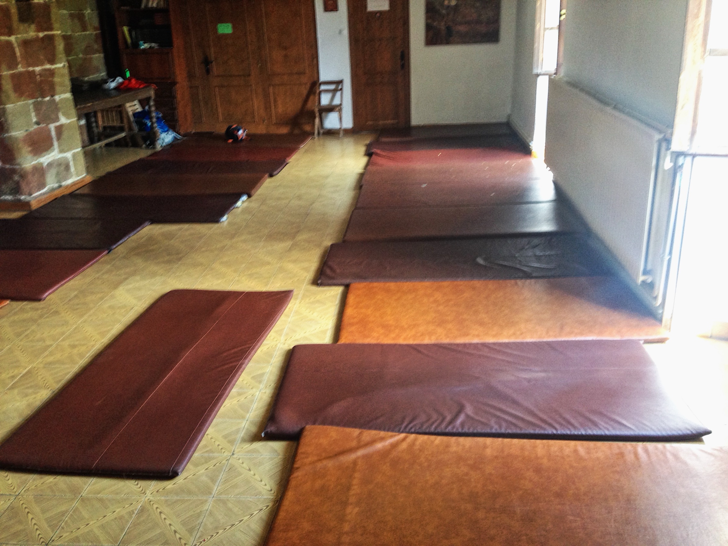 Mattresses laid out on the floor of a donativo albergue